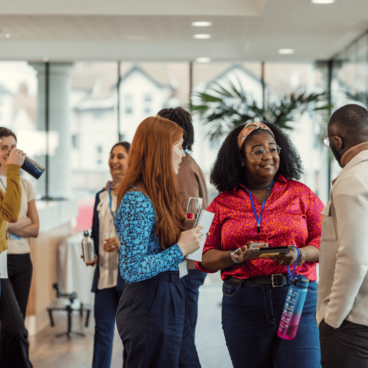 Group of people standing and talking to eachother