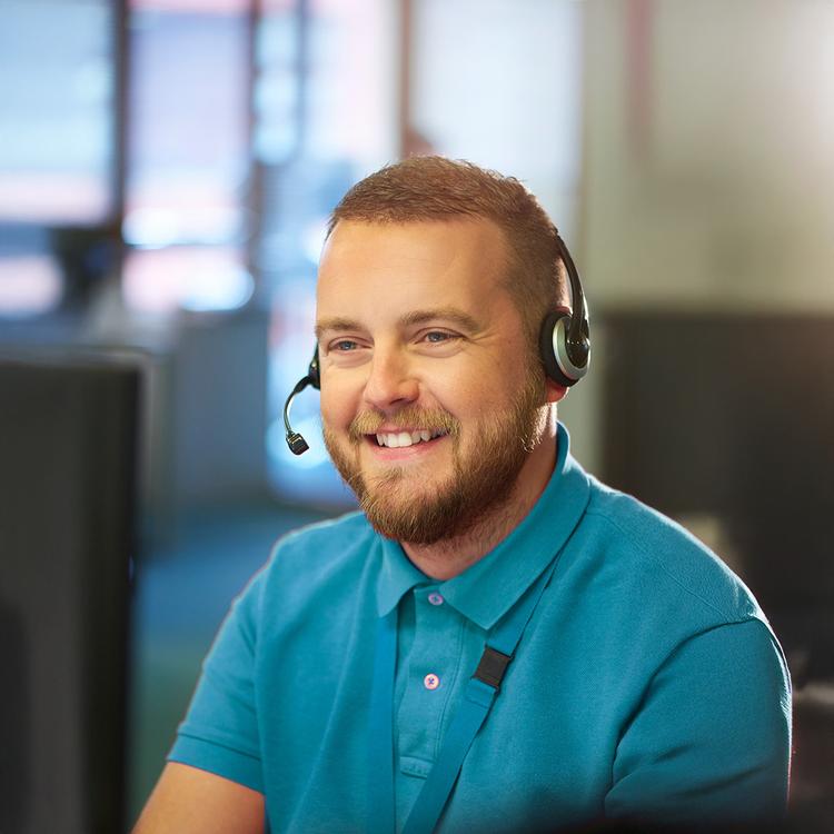 Man sitting with headset talking on the phone